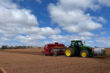 Out in the fields of PEI planting the new crop