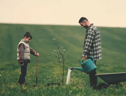 dad-son-watering-new-tree